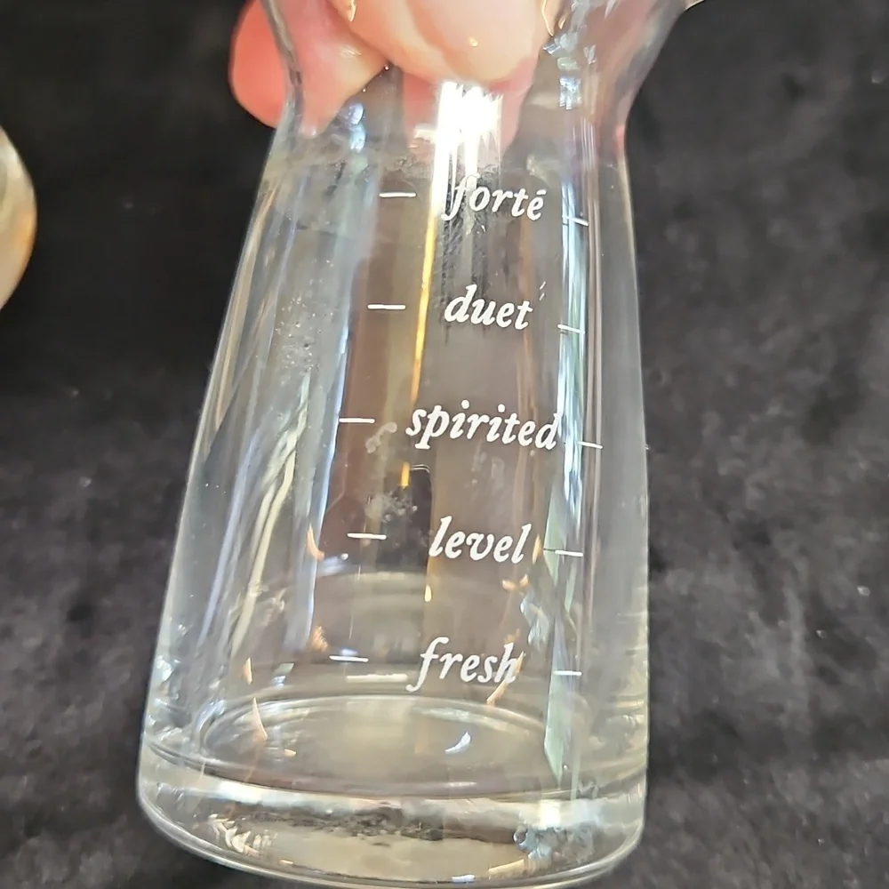 Set of 2 mini decanter or small measuring glass likely for wine or other liquids